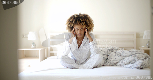 Image of Depressed Woman On The Bed