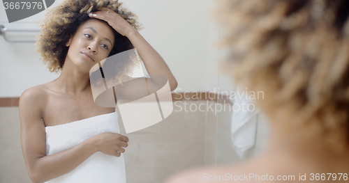 Image of Woman In Front Of The Mirror