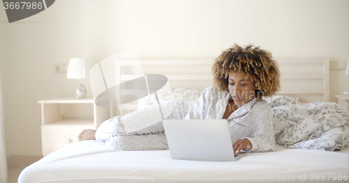 Image of Girl Surfing On The Internet At Home