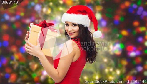 Image of beautiful sexy woman in santa hat with gift box