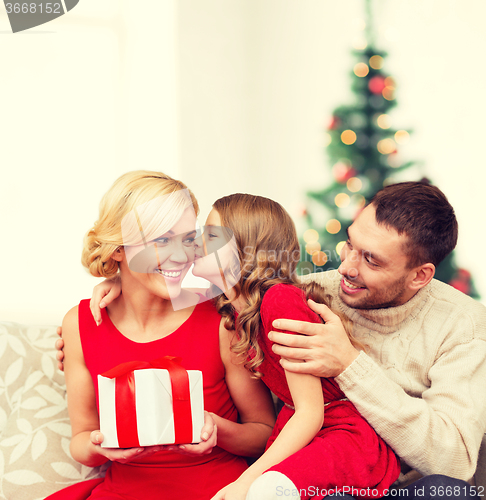 Image of adorable child kisses her mother