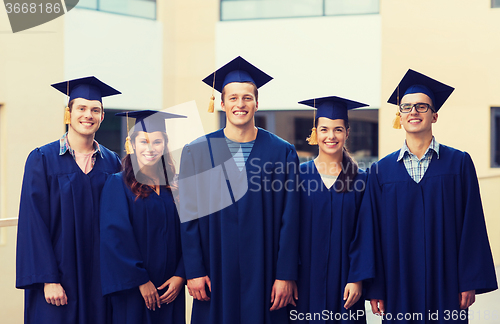 Image of group of smiling students in mortarboards