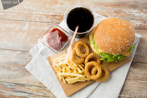 Image of close up of fast food snacks and drink on table