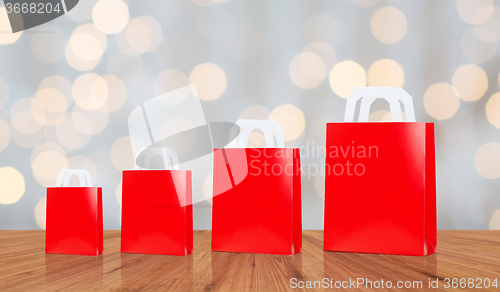 Image of many blank red shopping bags