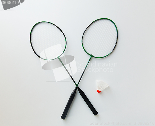 Image of close up of badminton rackets with shuttlecock