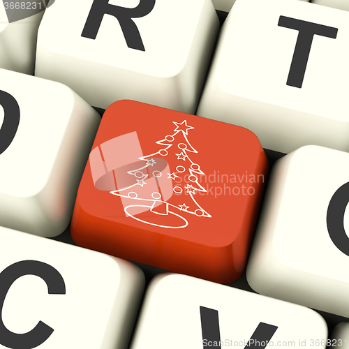 Image of  Xmas Tree Key Means Happy Christmas