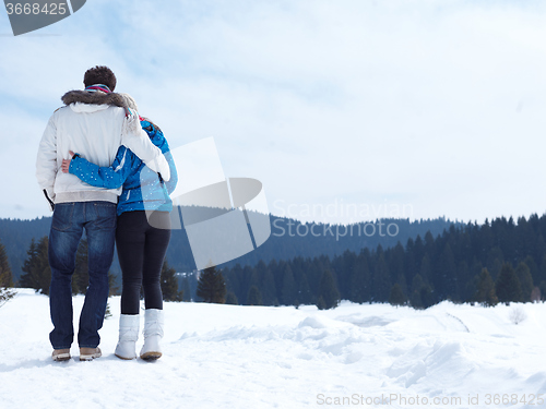 Image of romantic young couple on winter vacation