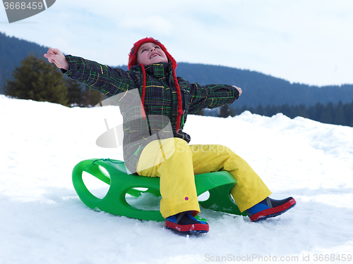 Image of happy young boy have fun on winter vacatioin on fresh snow