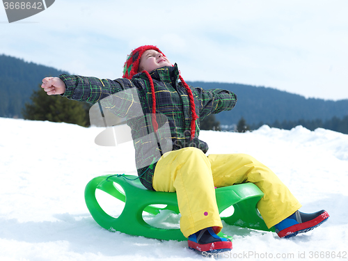 Image of happy young boy have fun on winter vacatioin on fresh snow