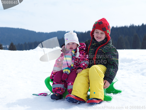 Image of portrait of boy and baby girl on winter vacation