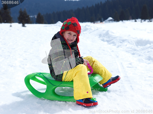 Image of happy young boy have fun on winter vacatioin on fresh snow