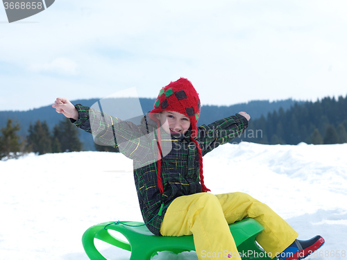 Image of happy young boy have fun on winter vacatioin on fresh snow