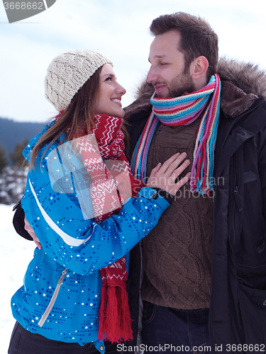 Image of romantic young couple on winter vacation