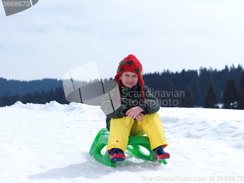 Image of happy young boy have fun on winter vacatioin on fresh snow