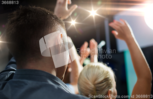 Image of close up of happy people at concert in night club