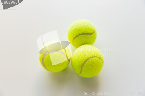 Image of close up of three yellow tennis balls
