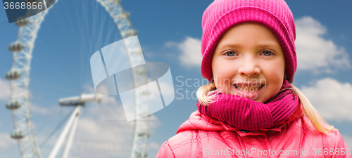 Image of happy little girl portrait over ferry wheel