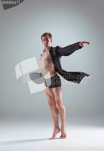 Image of The young attractive modern ballet dancer on gray background