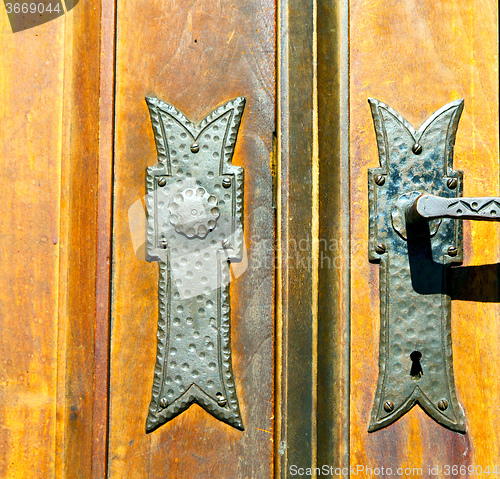 Image of castellanza blur lombardy   abstract    curch  closed wood cross