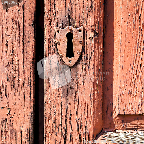 Image of door    in italy old ancian wood and traditional  texture nail