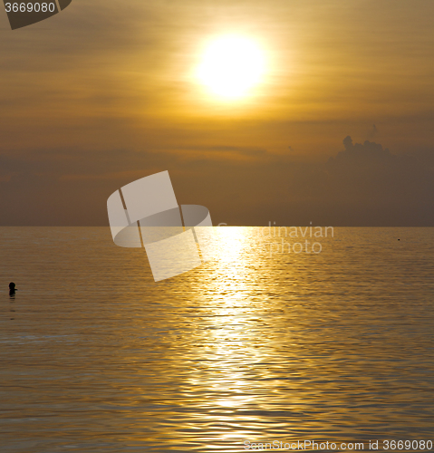 Image of kho phangan sunrise people boat  and water in thailand  bay coas