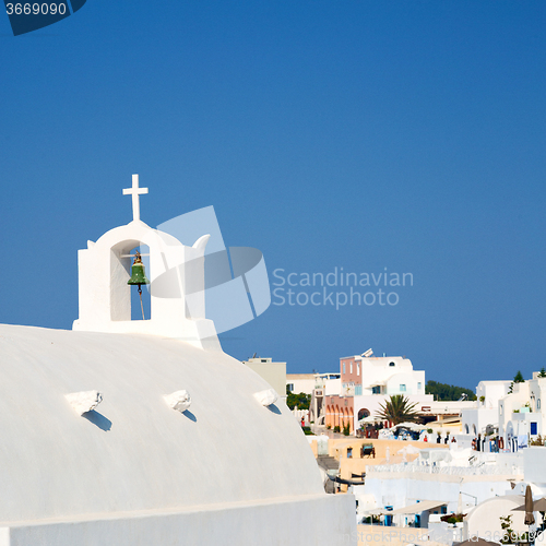 Image of cross  in santorini greece old construction and the sky