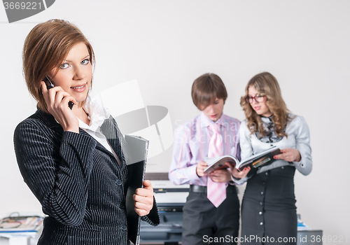 Image of Attractive businesswoman in office