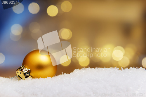 Image of Golden bauble on snow