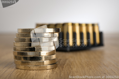 Image of Euro Coins with gun cartridges