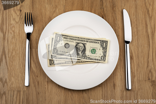 Image of Plate with dollar bills