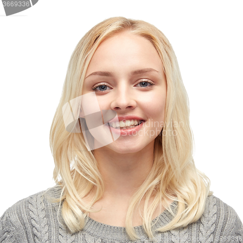 Image of smiling young woman or teenage girl in pullover