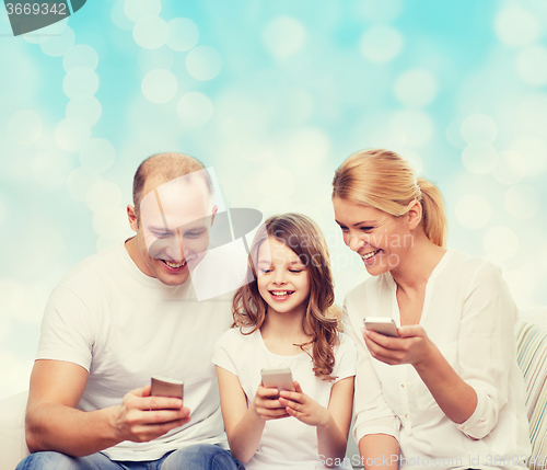 Image of happy family with smartphones