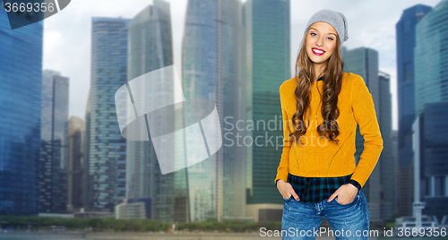 Image of happy young woman or teen girl over city