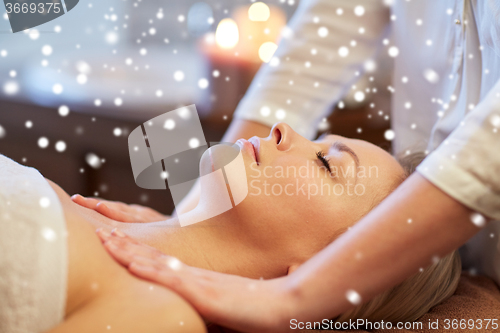 Image of close up of woman lying and having massage in spa