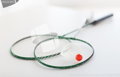 Image of close up of badminton rackets with shuttlecock