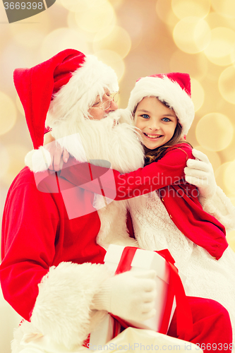 Image of smiling little girl with santa claus