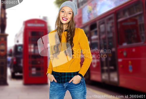 Image of happy young woman or teen over london city street