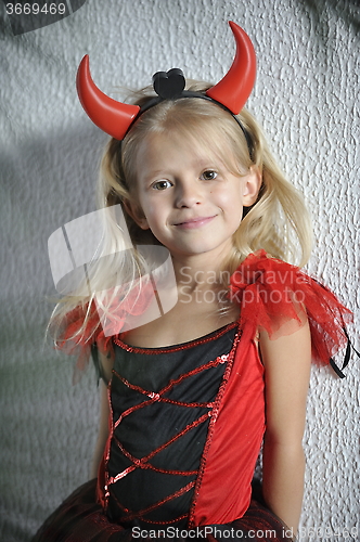 Image of Little girl in Halloween costume.