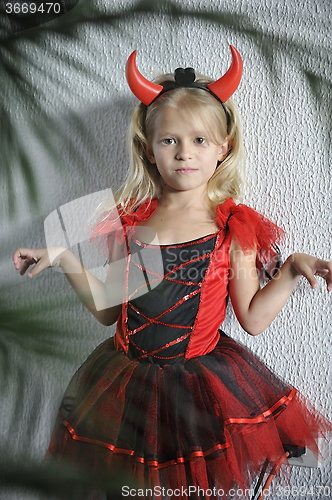 Image of Little girl in Halloween costume.