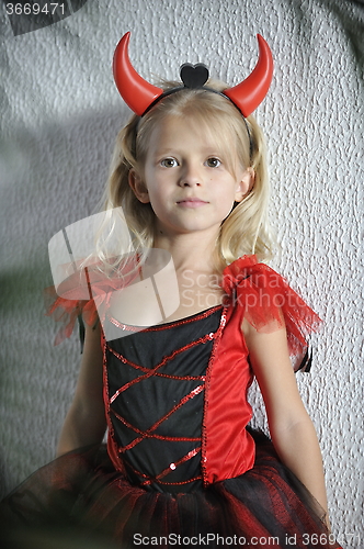 Image of Little girl in Halloween costume.