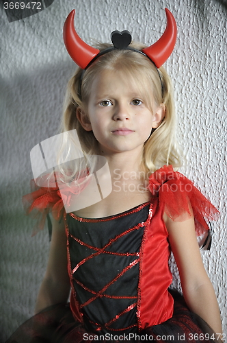 Image of Little girl in Halloween costume.