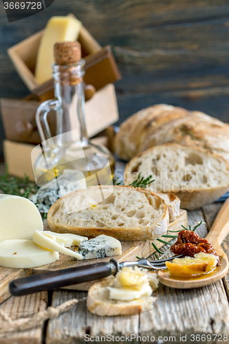Image of Homemade bread, cheese and olive oil.