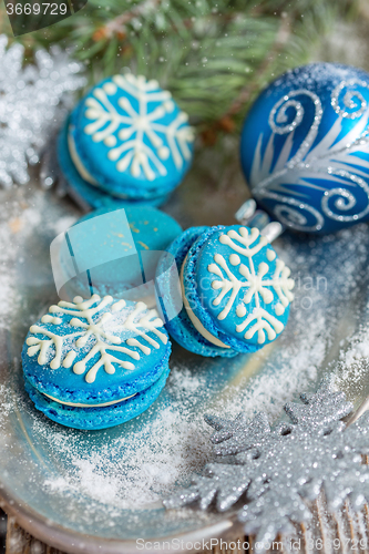 Image of Macarons with a pattern of snowflakes.