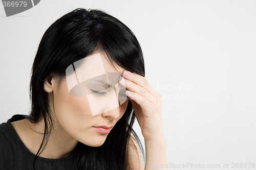 Image of Stressed businesswoman