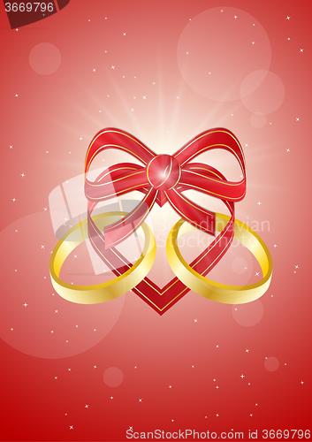 Image of ribbon heart with two gold rings