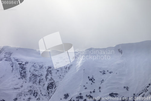 Image of Sunlight off-piste slope in mist