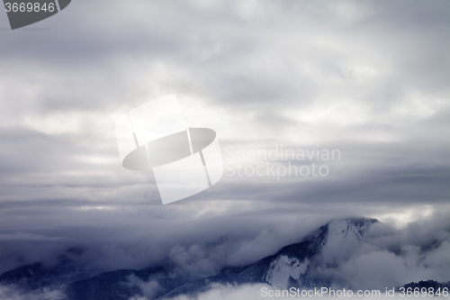 Image of Winter mountains covered with clouds