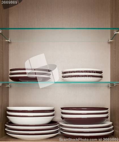 Image of mixed clean white and brown dishes 