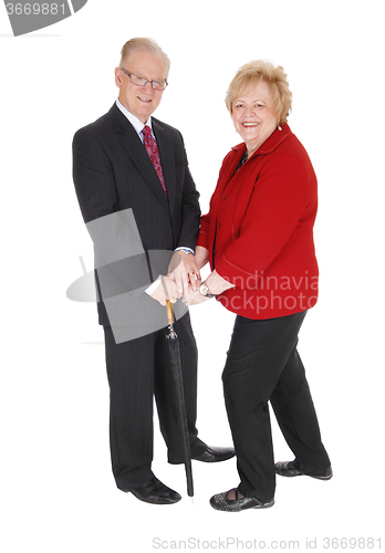 Image of Beautiful senior couple with umbrella.