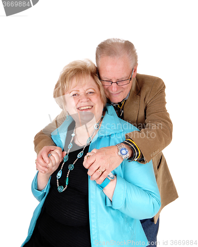 Image of Senior man hugging his wife.